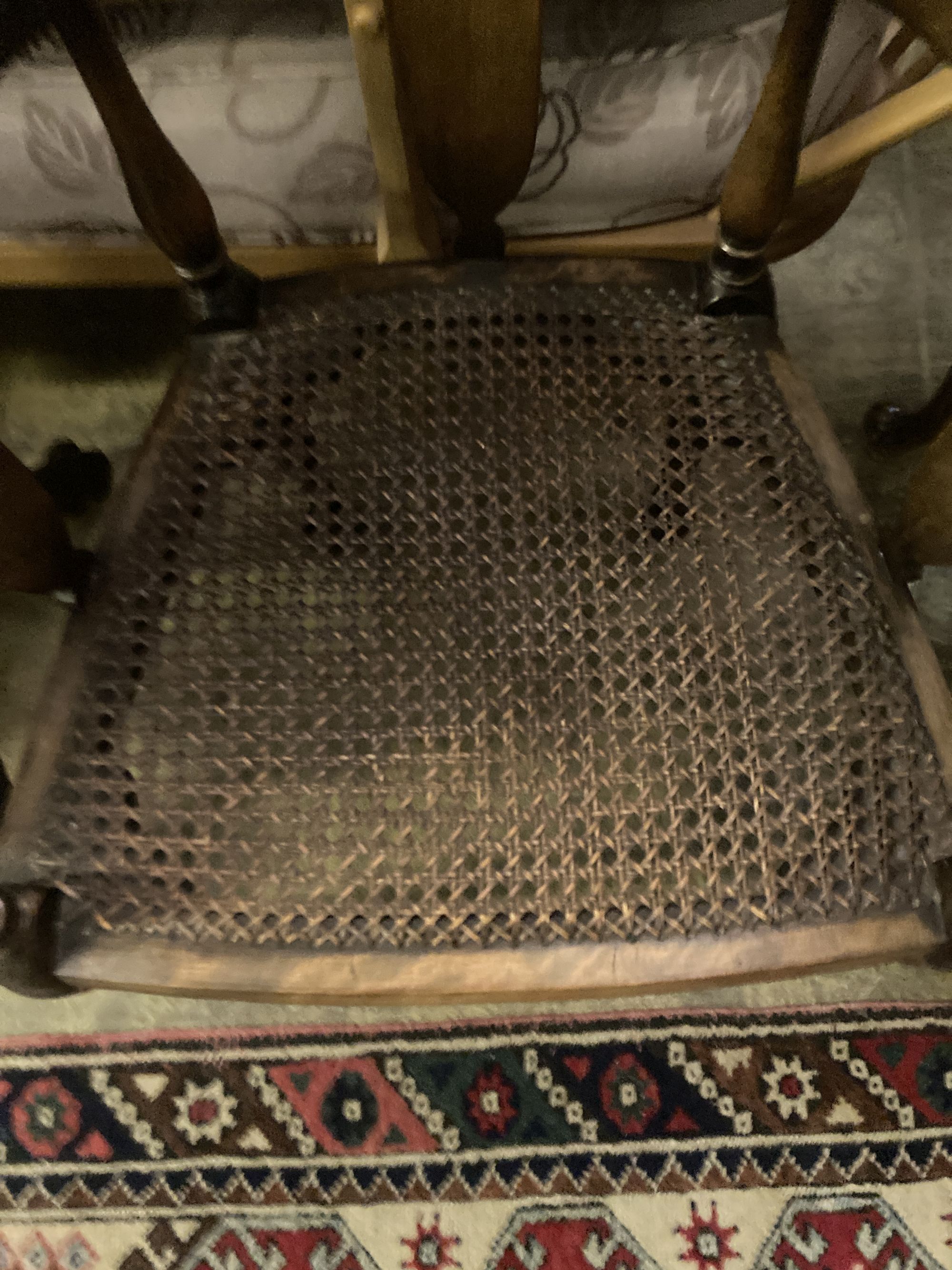 A 1920s circular caned beech occasional table, diameter 76cm, together with a pair of elbow chairs, one with a later tapestry seat